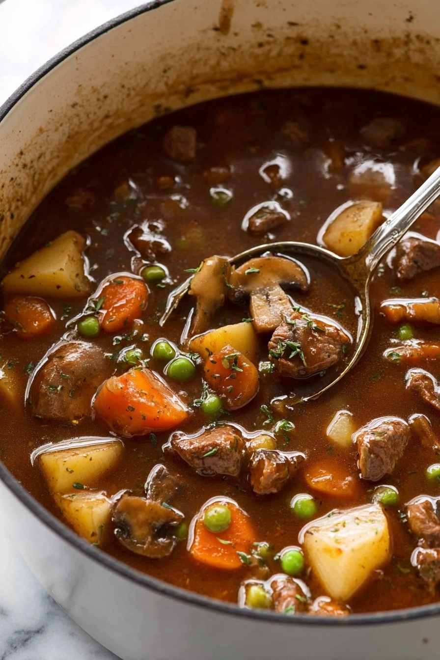 The image shows a close-up of a thick stew in a white pot, filled with multiple layers of chunky ingredients. The top layer has small pieces of browned meat, sliced mushrooms, orange carrot chunks, small green peas, and cubed light yellow potatoes, all mixed into a rich, dark brown broth. The texture of the stew looks smooth and slightly shiny, with bits of herbs sprinkled on the surface. A silver spoon is partially submerged inside the pot, which sits on a white marbled surface. photo taken with an iphone --ar 2:3 --v 7