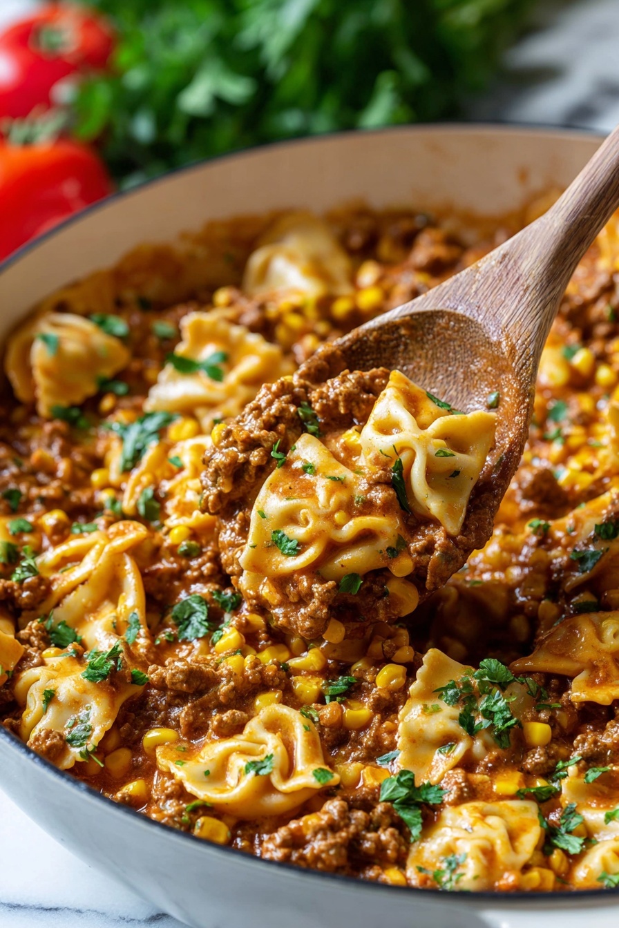 A close-up view of a white pan filled with a rich, creamy mixture of browned ground meat, yellow corn kernels, and folded light yellow pasta pieces, all coated in a thick, brownish-orange sauce. Fresh green herbs are sprinkled over the dish for a pop of color. A wooden spoon scoops up a portion, showing the textures and layers clearly, with the sauce clinging lightly to the ingredients. The pan is set against a white marbled surface with blurred green and red elements in the background. Photo taken with an iphone --ar 2:3 --v 7
