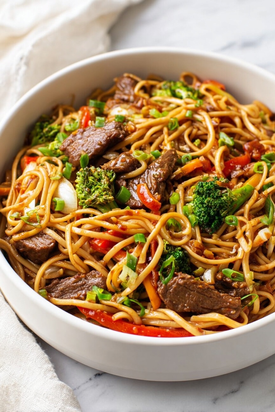 The image shows two parts: on the left, a white round plate filled with many small browned pieces of cooked meat with a slightly rough and seared texture, spread evenly and filling the plate. On the right, a stainless steel pan with browned bits stuck at the bottom, and a clear liquid being poured from a green bottle into the pan. The pan sits on a white marbled surface. Photo taken with an iphone --ar 2:3 --v 7