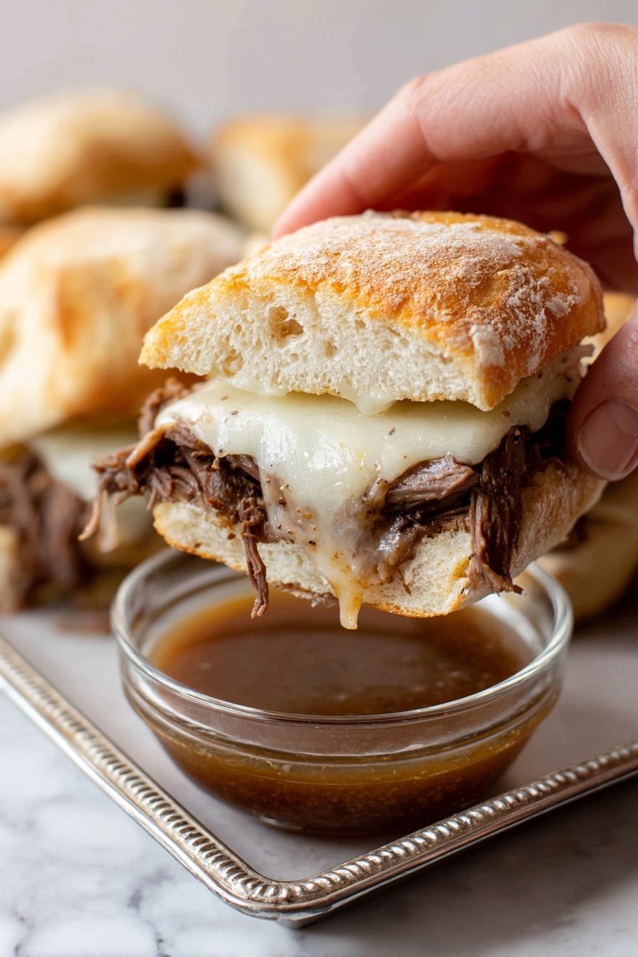 A large black slow cooker is shown from above with a piece of browned meat placed in it. The meat has a rough texture, mostly dark brown with some lighter brown areas, and is partially covered with a light beige powder mixed with small bits of orange and white flakes. Next to the slow cooker on a white marbled surface, there are two clear glass measuring cups, one filled with a light brown liquid and the other with a clear liquid. The scene is clean and bright with soft natural light. Photo taken with an iphone --ar 2:3 --v 7