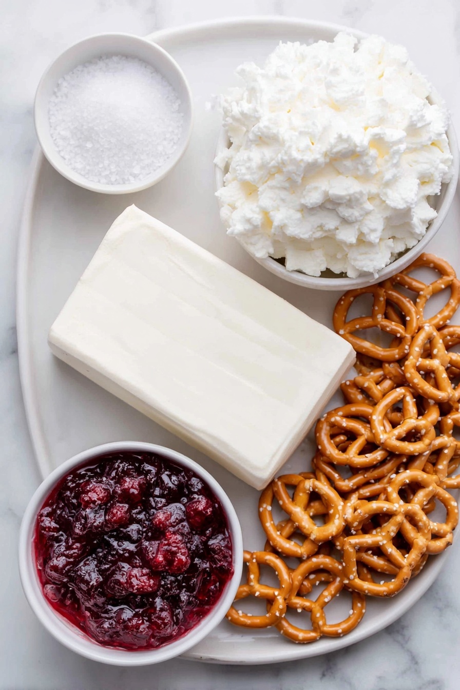 Flat lay of a block of soft cream cheese on a simple white ceramic plate, a small white bowl filled with granulated sugar, a tiny pinch of coarse salt displayed beside it on the plate, a fluffy mound of white whipped topping lightly fluffed on a white ceramic dish, a small white bowl containing bright red strawberry pie filling with visible strawberry pieces, a neat pile of golden-brown mini twist pretzels and pretzel crisps arranged beside the bowls, all ingredients fresh and natural looking, placed on a clean white marble surface, soft natural light, photo taken with an iPhone, professional food photography style, fresh ingredients, white ceramic bowls, no bottles, no duplicates, no utensils, no packaging --ar 2:3 --v 7 --p m7354615311229779997