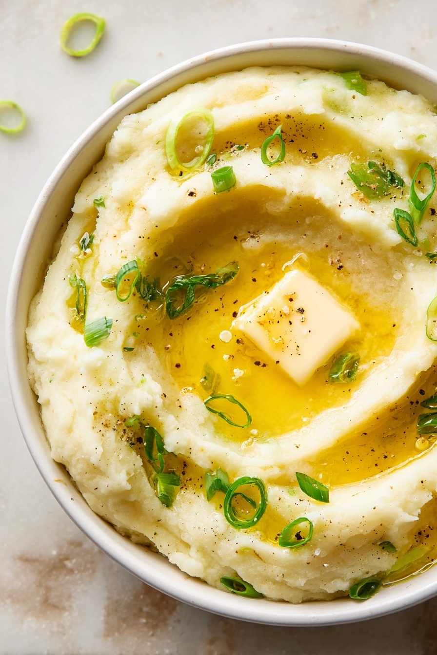 A round silver pot sits on top of a light cream cloth on a white marbled surface. Inside the pot is a creamy light yellow liquid filled with small pieces of green leafy vegetables, creating a speckled pattern. A large wooden spoon with a smooth grain texture rests inside the pot, partially submerged in the mixture, facing upwards. The green leaves are evenly spread throughout the creamy layer, making a fresh and soft look. photo taken with an iphone --ar 2:3 --v 7